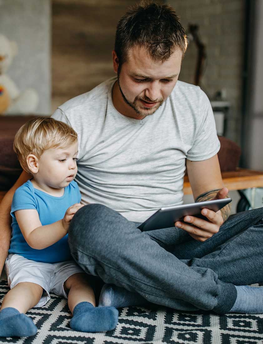 man viewing savings account for son with free online banking app